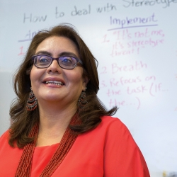 Dr. Leticia Márquez-Magaña in front of a whiteboard