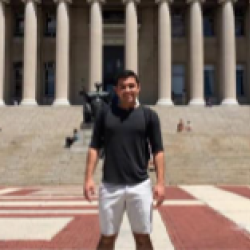 Shane pictured in front of a building