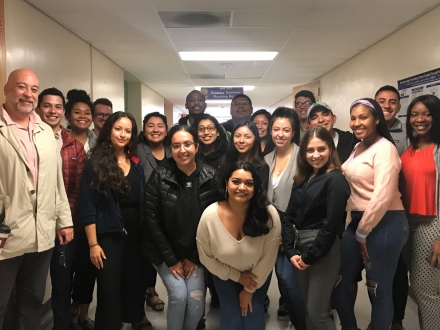 16 members of the LCOE APP program posing for a group photo.
